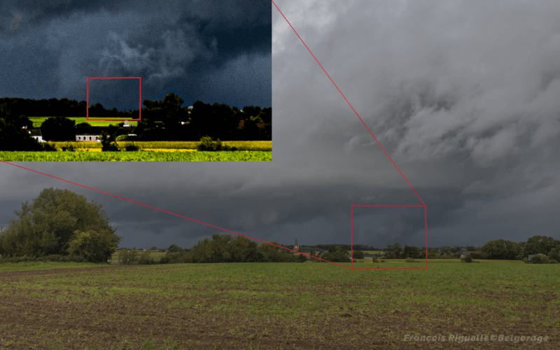 Photographie de l'orage transitant sur Beauvechain, le 26 septembre 2024 à 18h02, vu depuis Lathuy. En zoomant sur la zone du courant ascendant et en ajoutant des contrastes, la tornade est visible. Crédit photo : François Riguelle